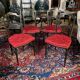 Set of four Napoleon III chairs in black lacquered wood with gold highlights.