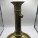 Candle holder with a pusher