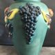 Green ceramic vase with polychrome decoration of fruits and vegetables in relief 33.5 cm
