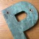 Ancient letter sign metal P