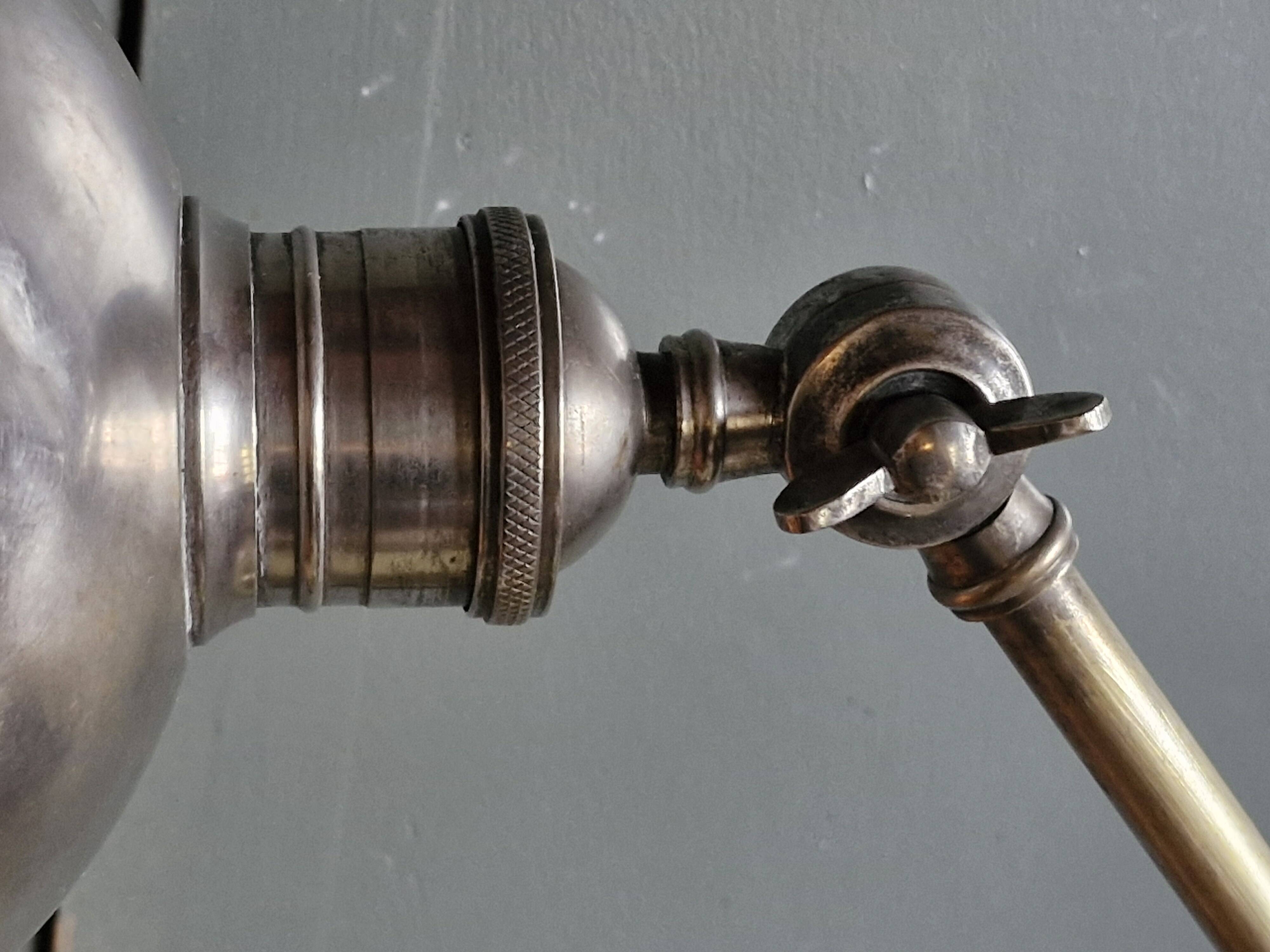 Old adjustable industrial lamp in bronze with 2 arms.