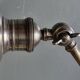 Old adjustable industrial lamp in bronze with 2 arms.