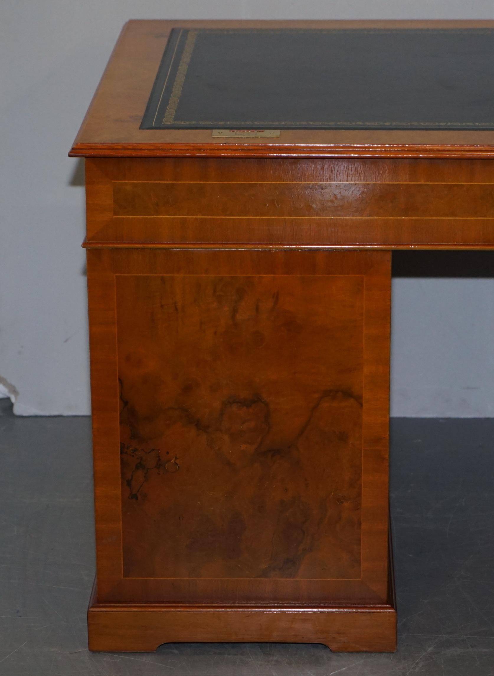 Partner desk in burr walnut designed to conceal computer equipment.