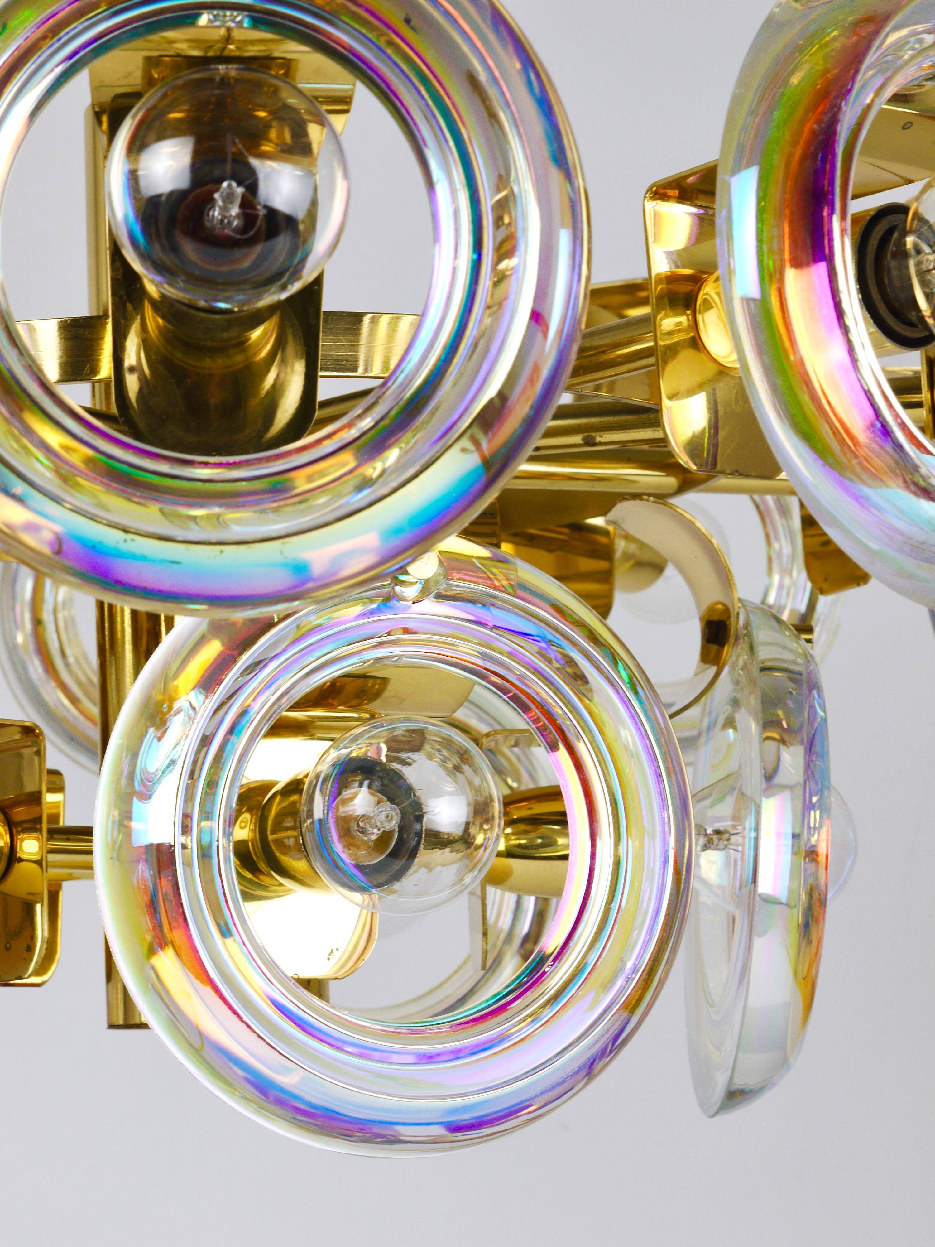 Large brass chandelier by Oscar Torlasco, rainbow optical glass rings, Italy, 1970s.