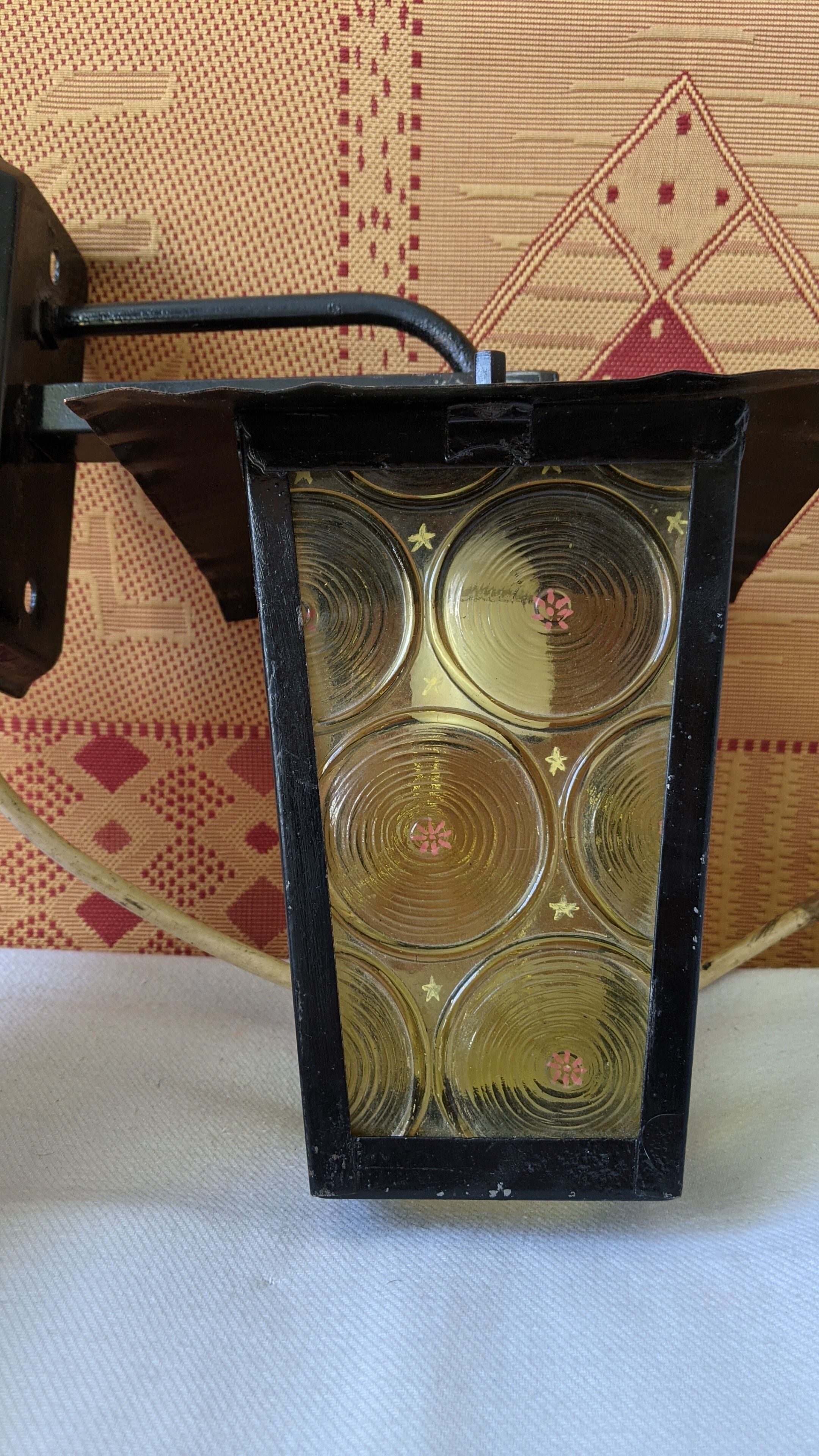 Pretty iron and glass lantern In very good condition black iron color of yellow glass relief circ