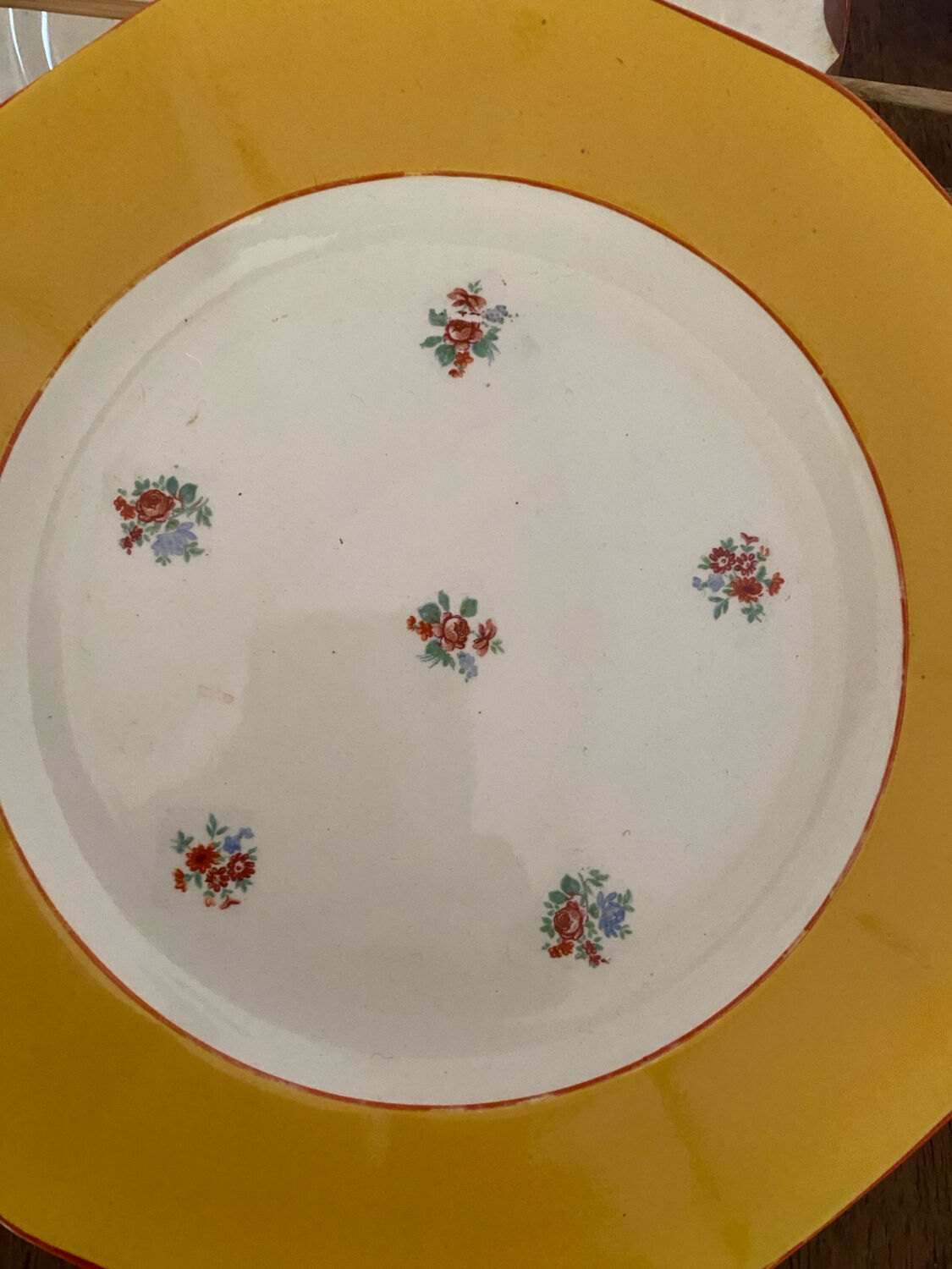 Flowered stamped dessert plates and matching ones.