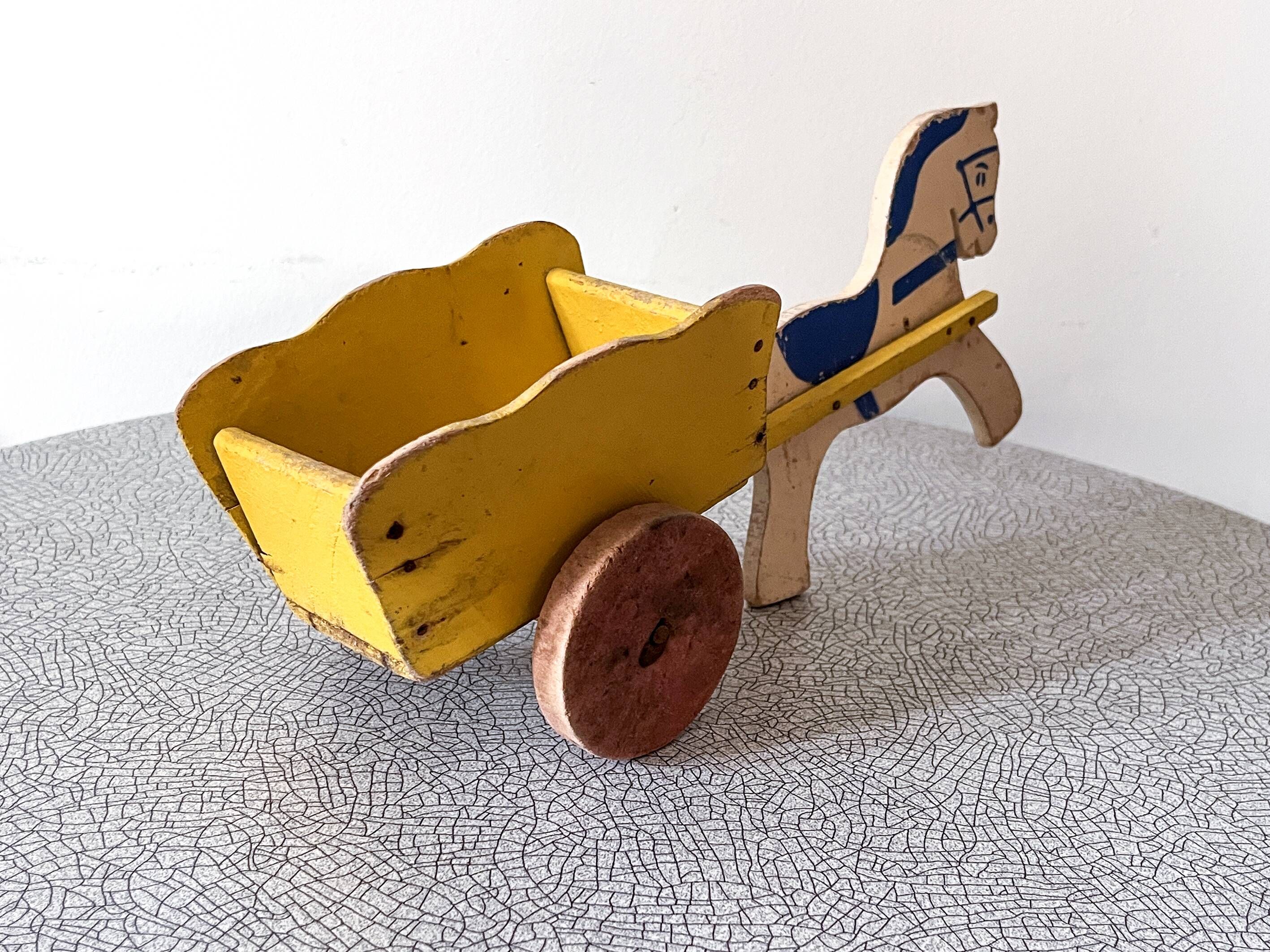 Horse cart and cart, old wooden pull toy.