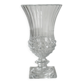 Antique thick glass vase on a pedestal.