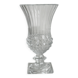 Antique thick glass vase on a pedestal.