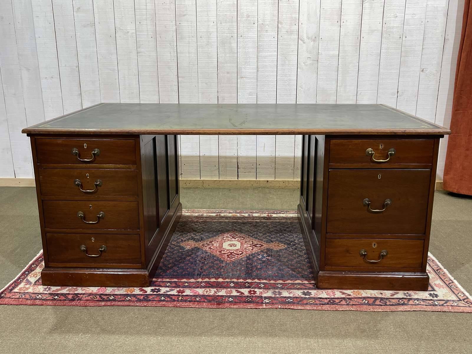 Large English flat desk in mahogany with leather top, early 20th century