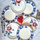 Old mismatched flat plates in earthenware