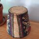 Ethnic basket in multicolored braided straw