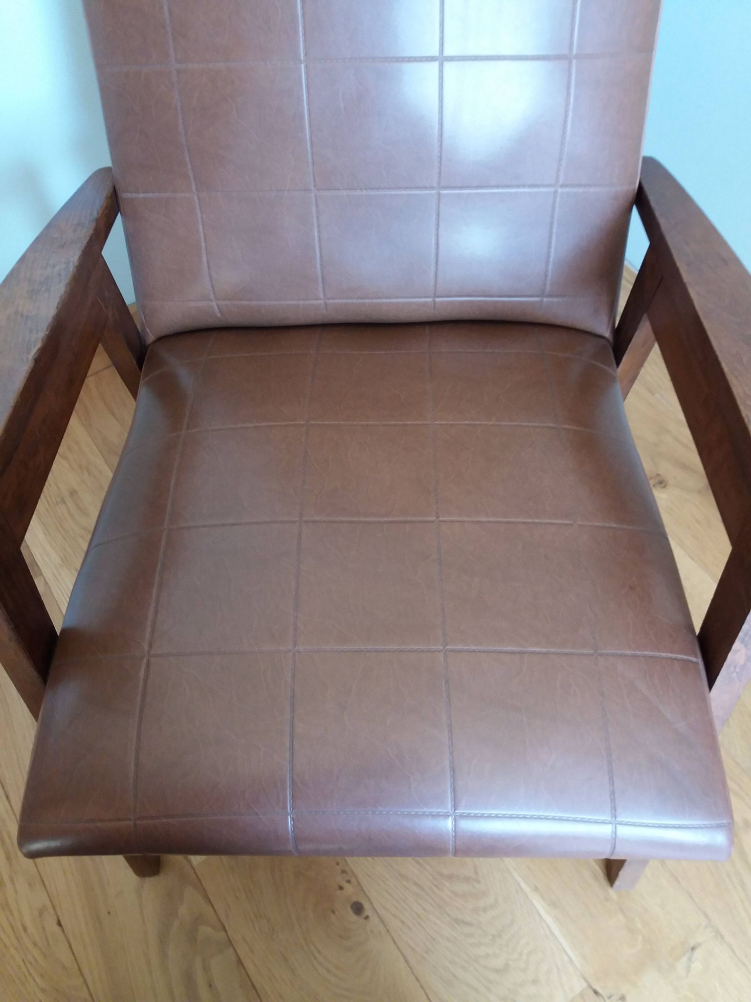 Scandinavian brown skai and wood armchair