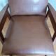 Scandinavian brown skai and wood armchair