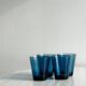 Four small translucent blue glasses.