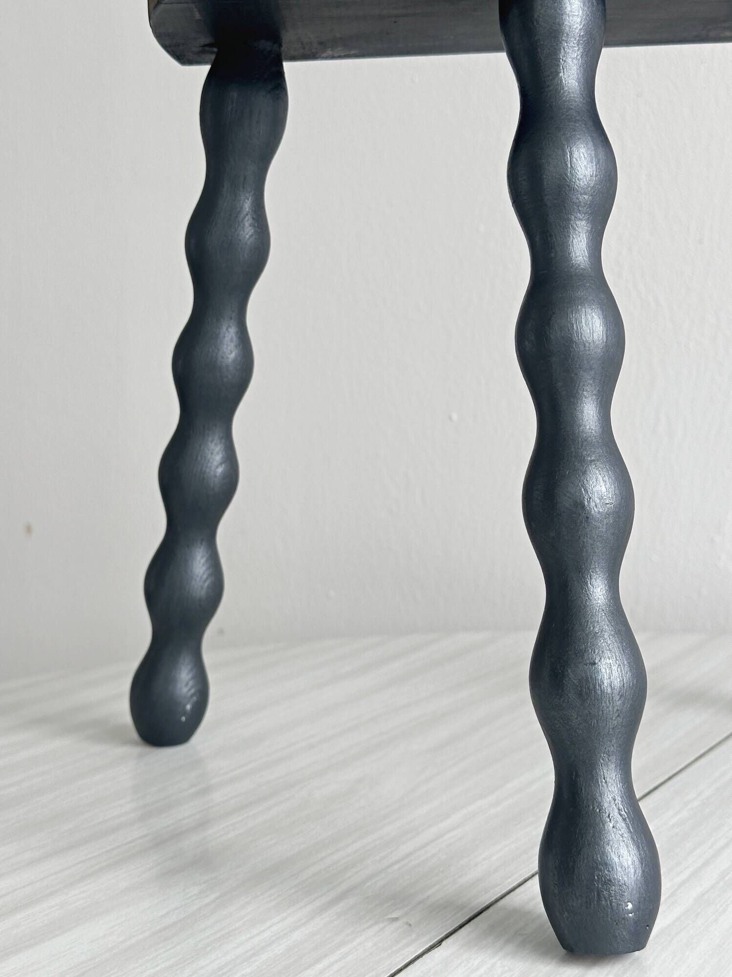 Antique wooden tripod stool with turned legs