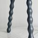 Antique wooden tripod stool with turned legs