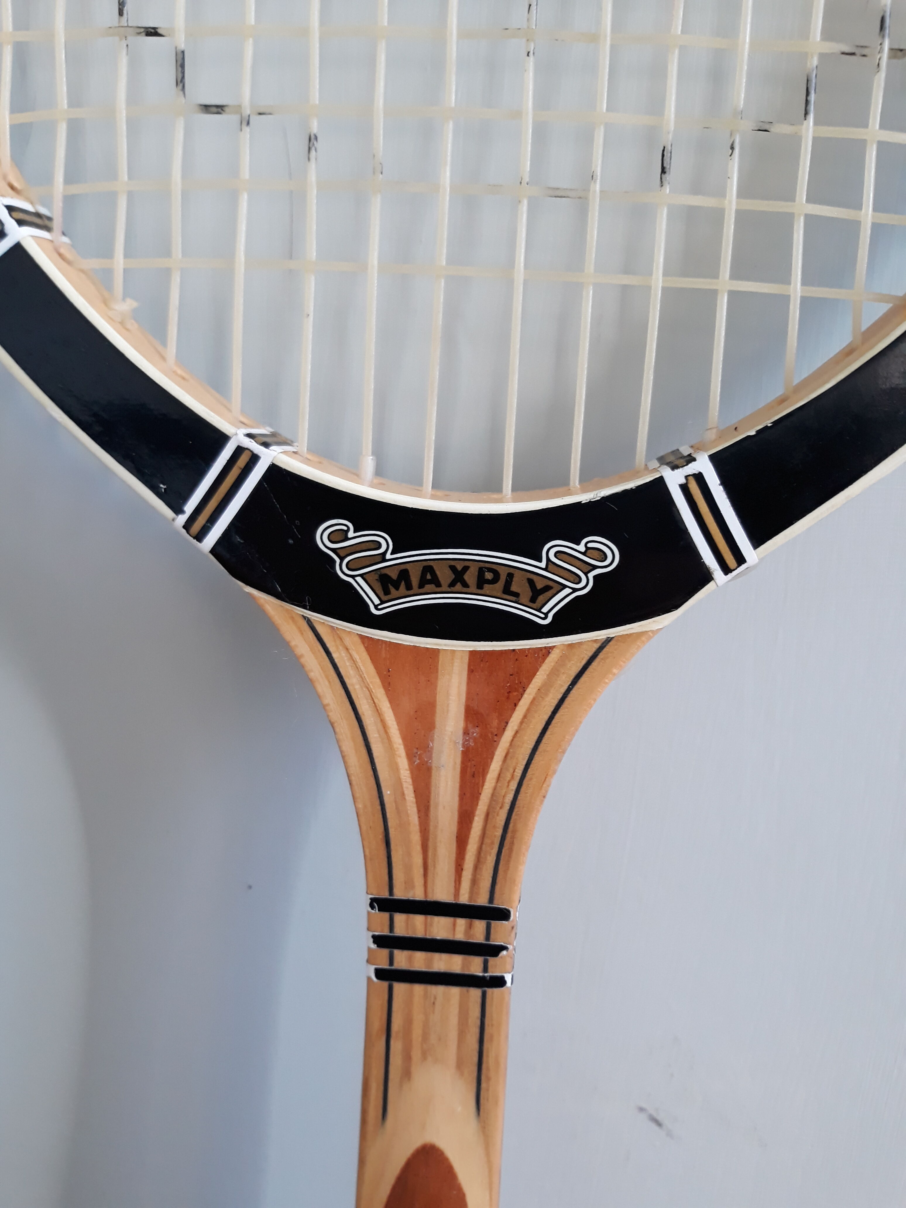 Wooden Dunlop tennis racket with its cover