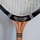 Wooden Dunlop tennis racket with its cover