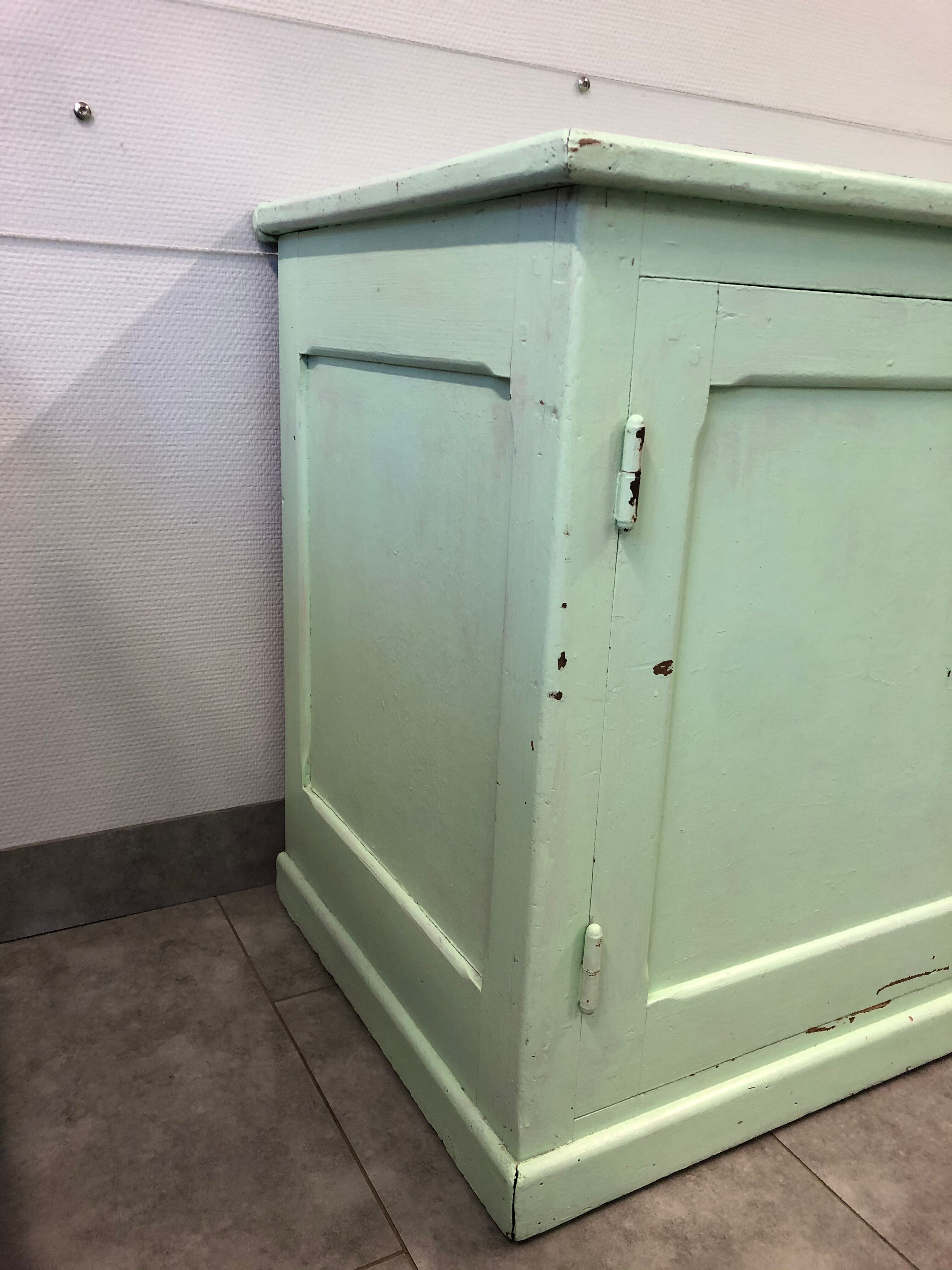 Low green patinated furniture