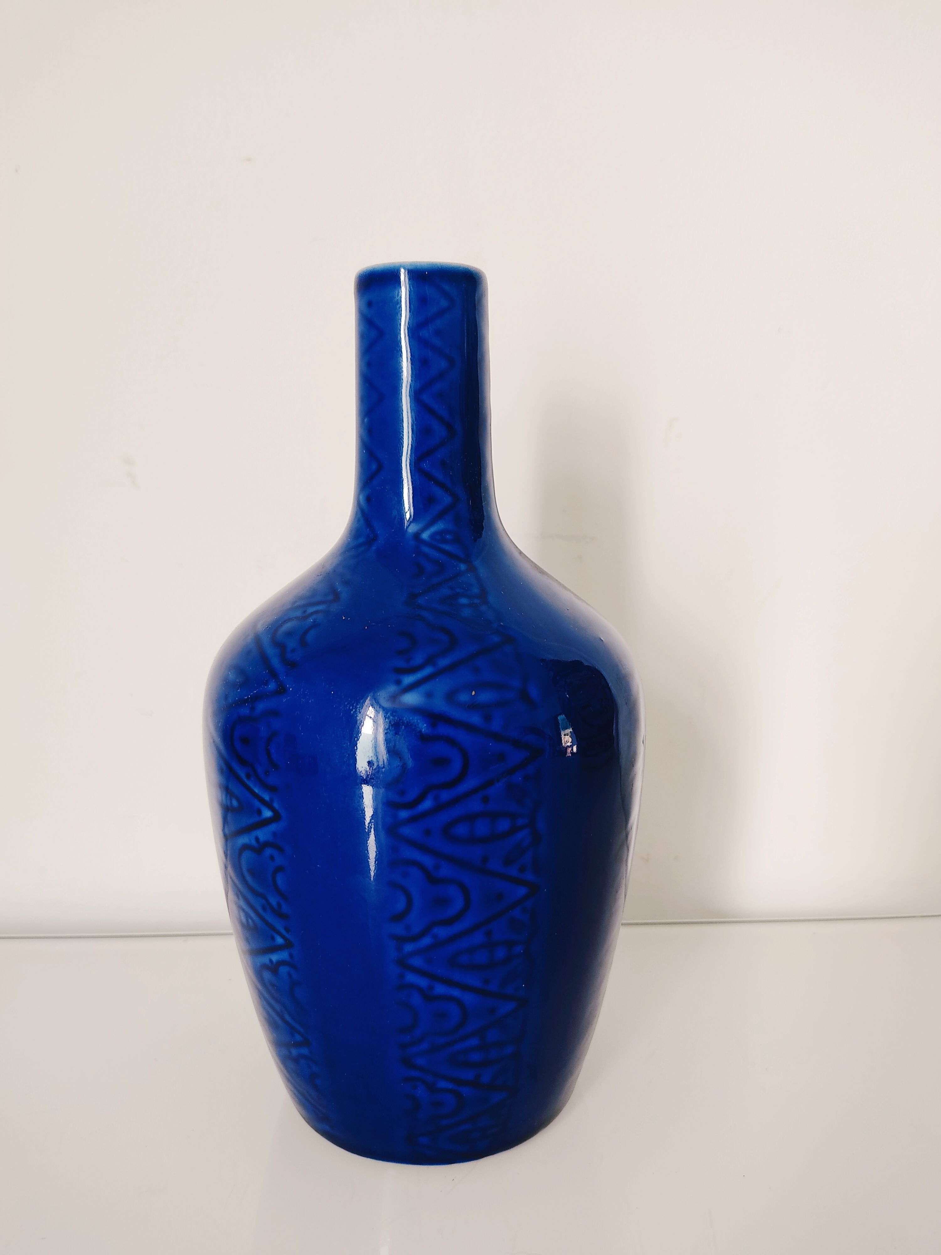 Blue vase geometric incised decoration