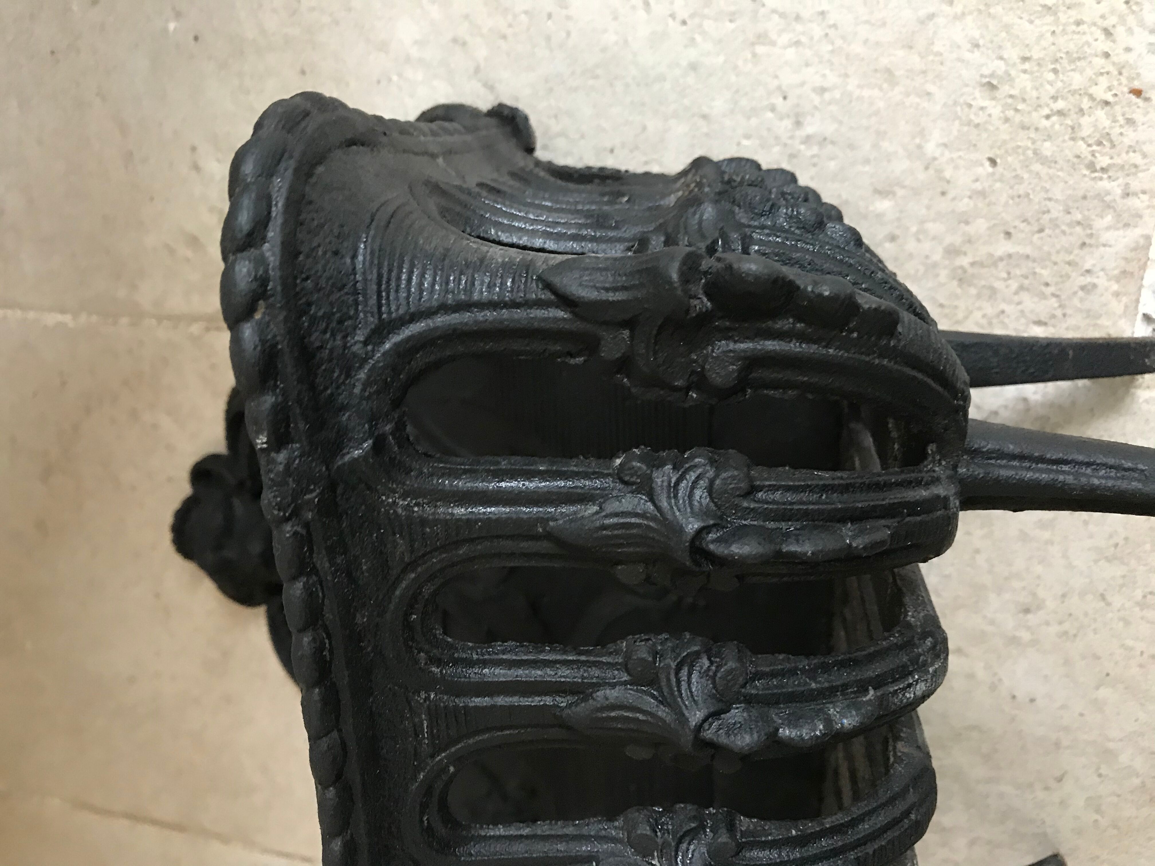 Cast iron fireplace cradle log holder