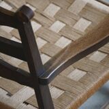 A pair of modern and sculptural vintage Danish armchairs in oak and papercord, 1940s.