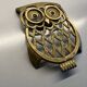 Old brass owl table mat