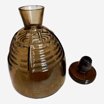 Brown glass decanter with its cap