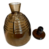 Brown glass decanter with its cap
