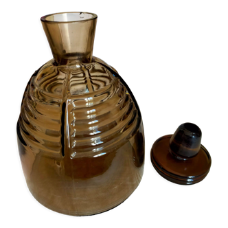 Brown glass decanter with its cap