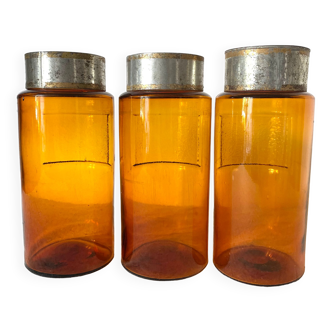 Pots à pharmacie anciens en verre ambrés