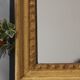 Miroir doré longiligne ancien à la feuille d'or et teinte grise 36x121cm