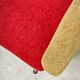 Red and mustard yellow fabric armchair in 1970s style