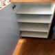 New oak storage furniture with a signed artisanal mosaic top.