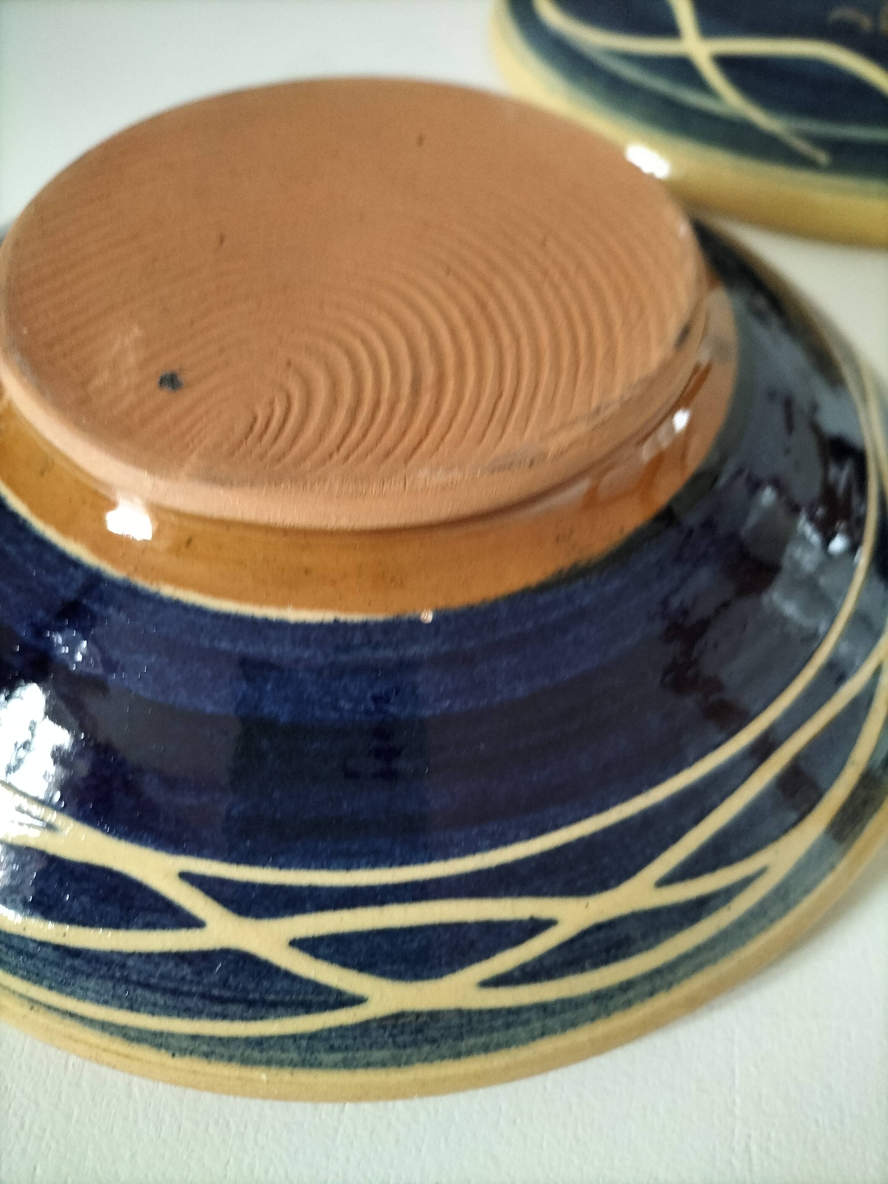 Pair of handcrafted bowls by Le Fer Rouge with blue and beige decor