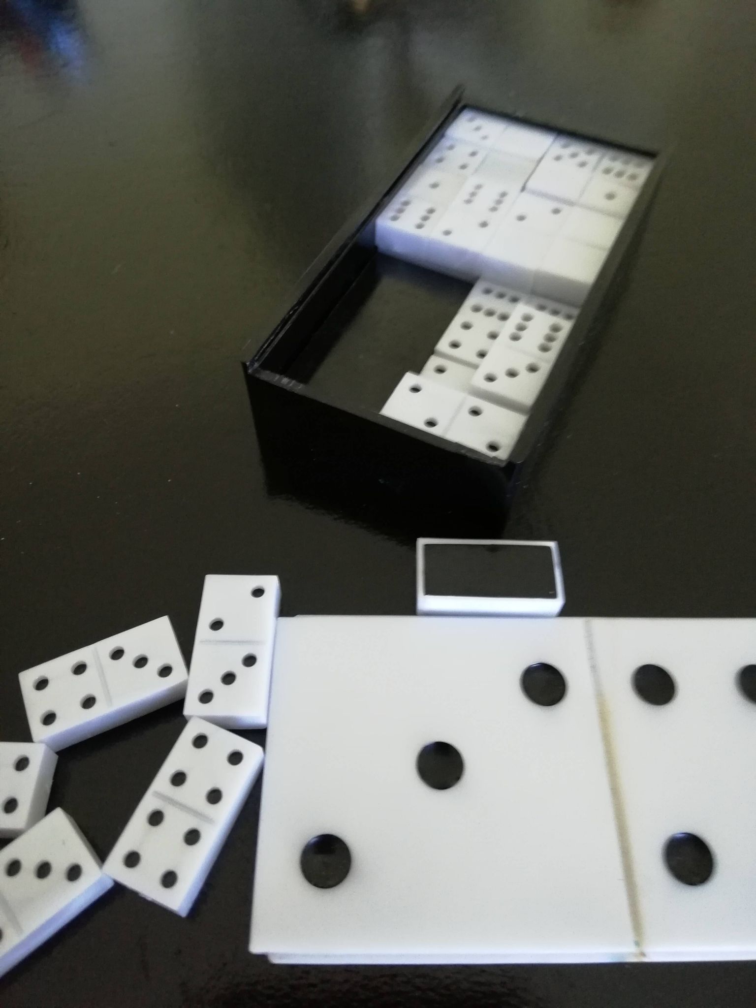 Complete set of Miniature Dominos in a Black and White Box.