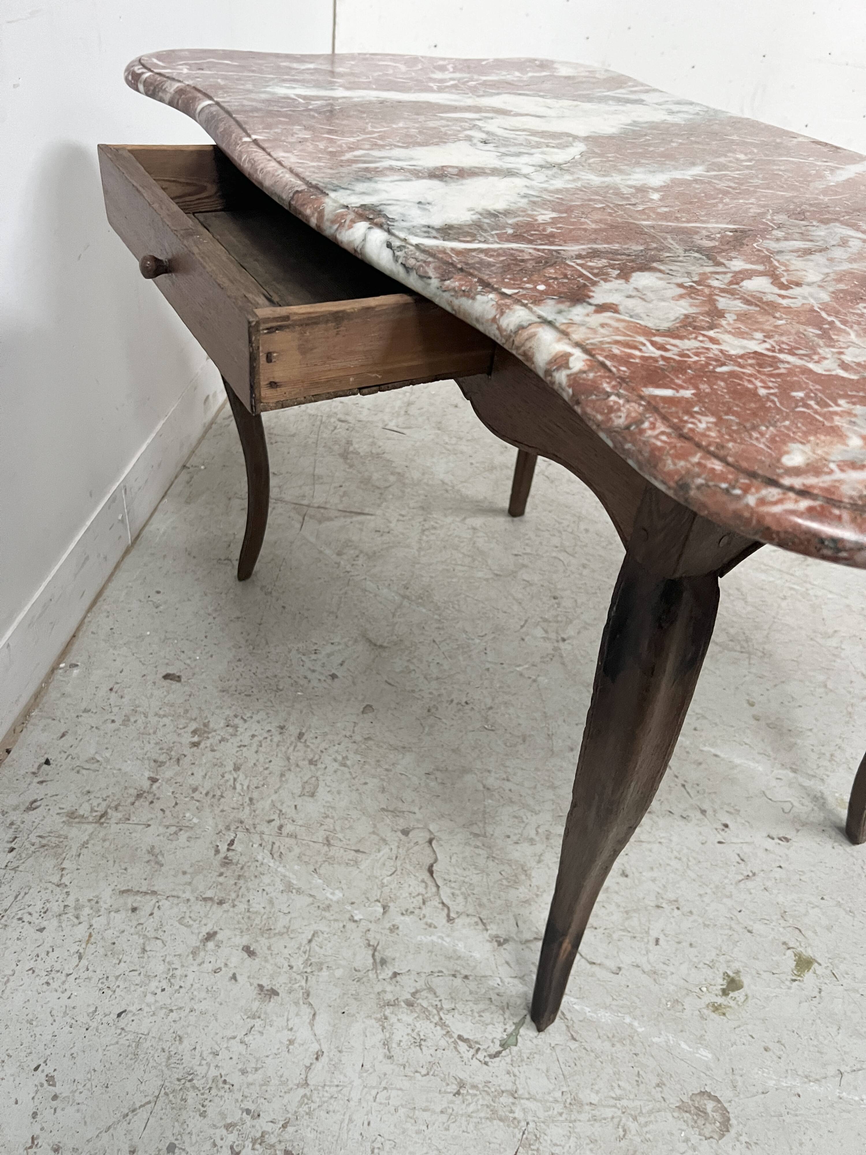 Louis XV mid-table in oak and marble, 18th century.