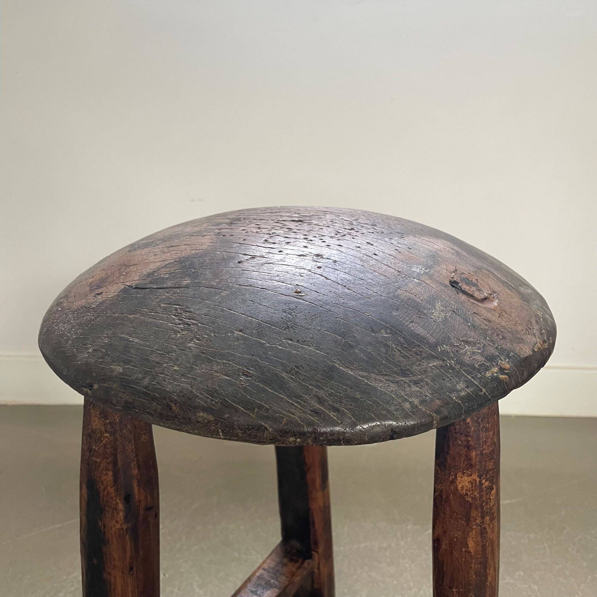 Antique tripod wooden stool, brutalist, wabi sabi style