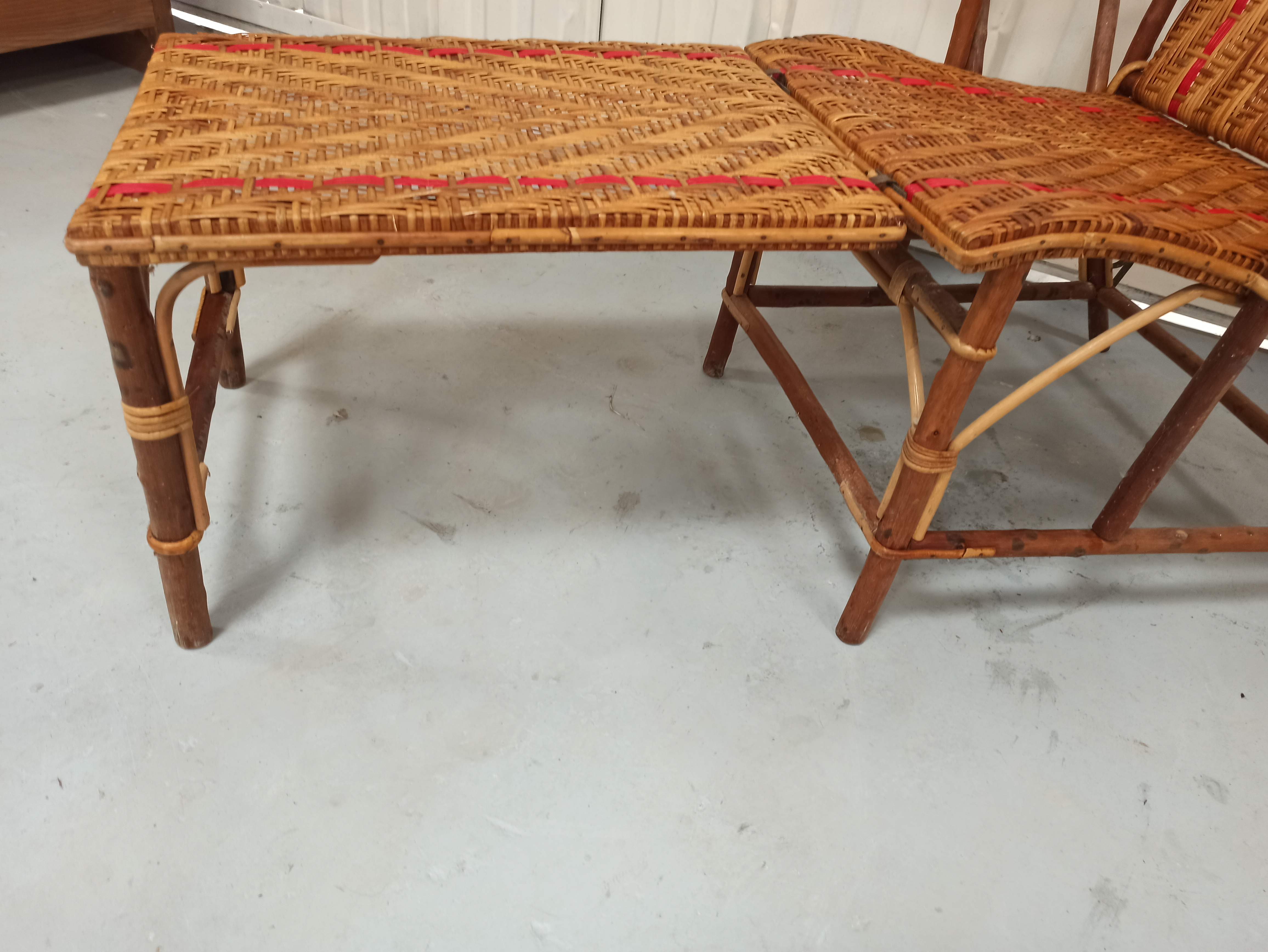 Sunbathing sunbathing in wicker rattan wood deckchair red lounger