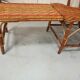 Sunbathing sunbathing in wicker rattan wood deckchair red lounger