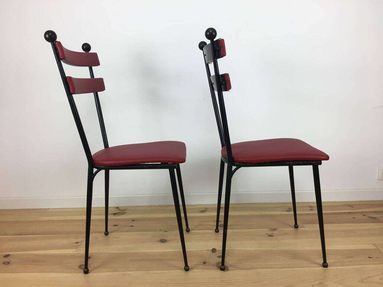 Pair of 1950s chairs in metal and red faux leather, Gueden-Adnet style.