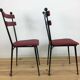 Pair of 1950s chairs in metal and red faux leather, Gueden-Adnet style.