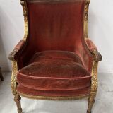 Two Louis XVI style wing chairs in gilded wood, 20th century