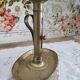 Brass pusher candle holder on oval frame