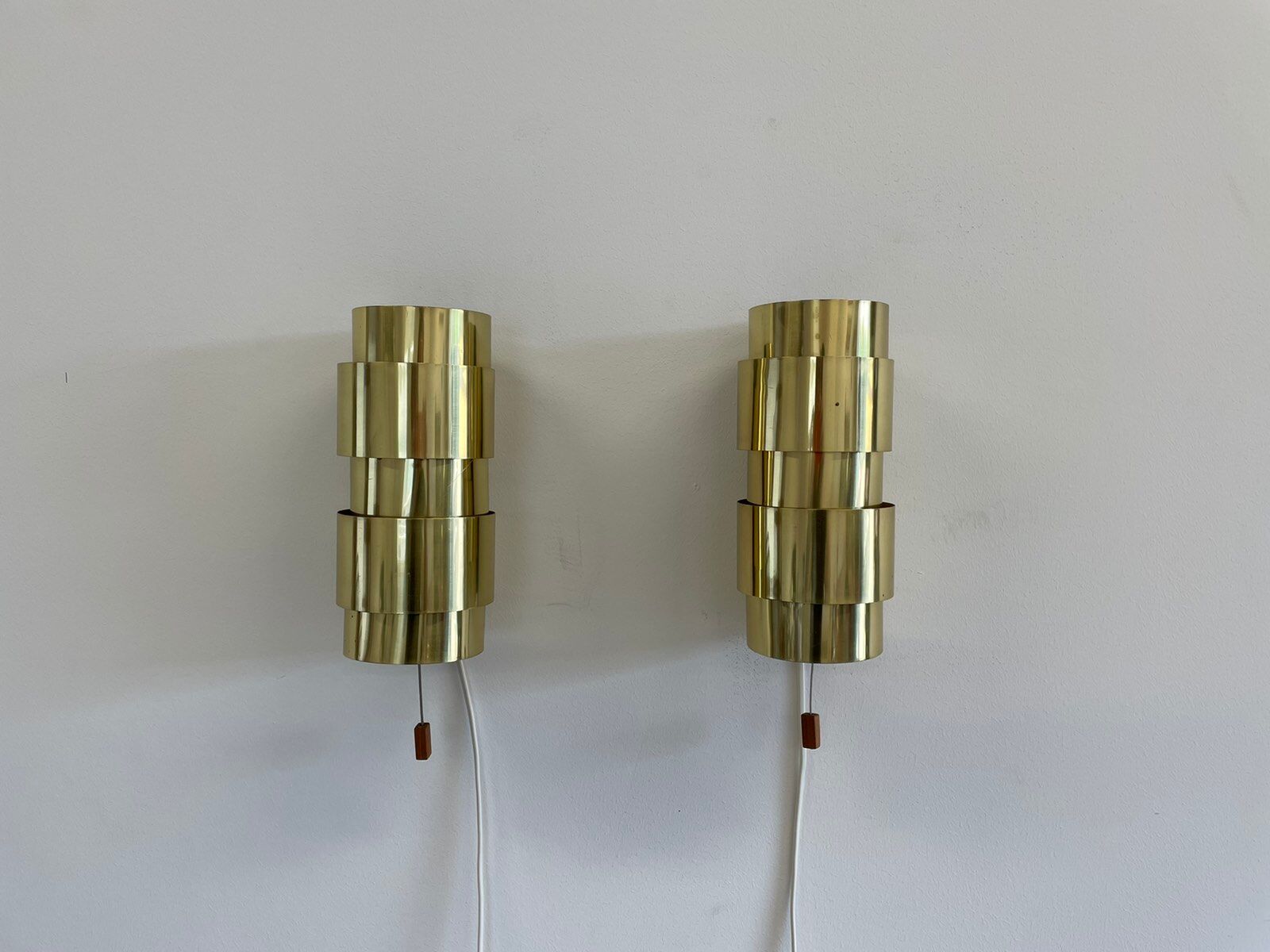 Pair of Scandinavian teak and brass sconces