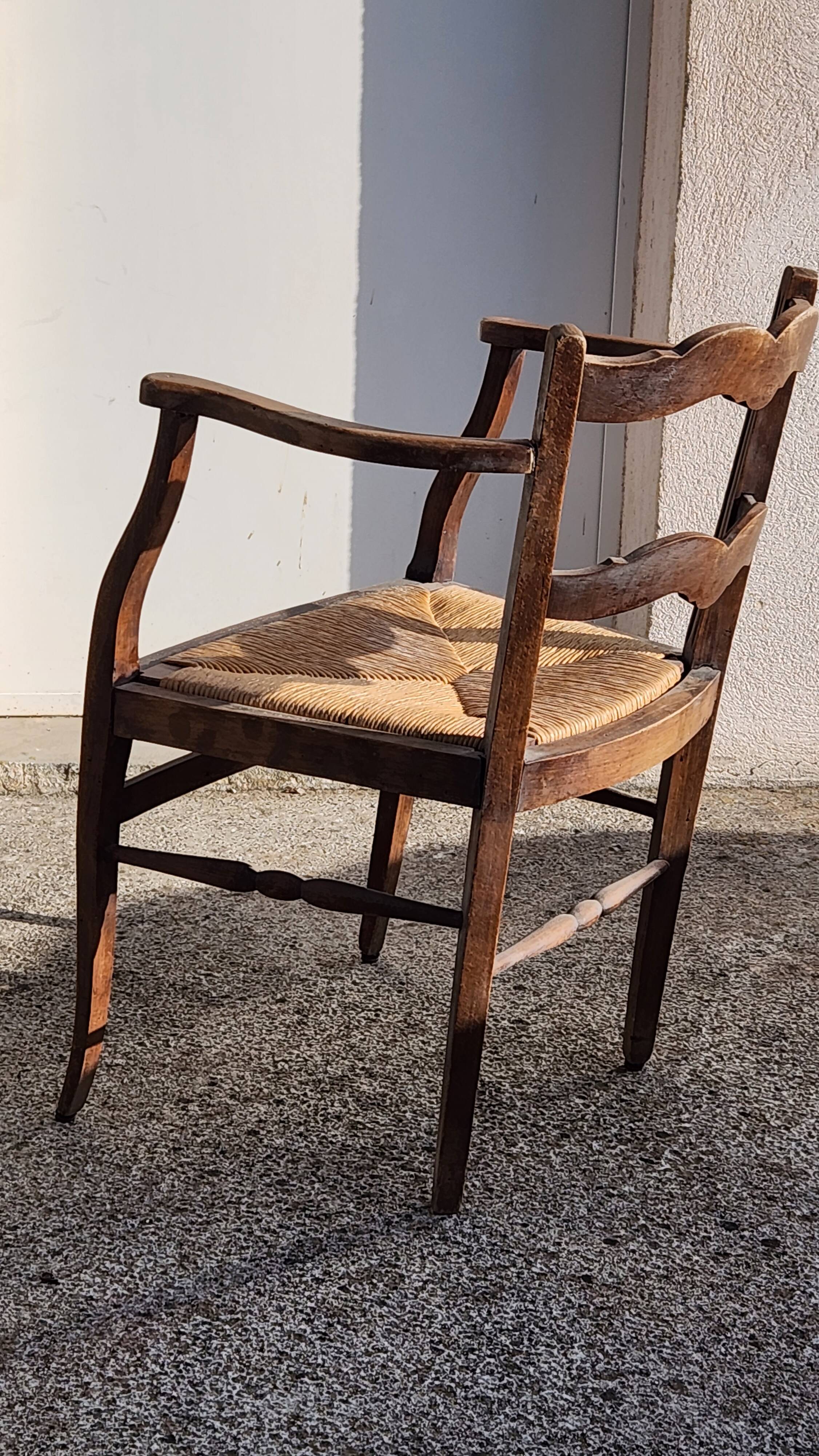 Rustic armchair made of wood and straw