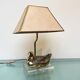Vintage brass table lamp in the shape of a duck from the 1970s on an acrylic base.