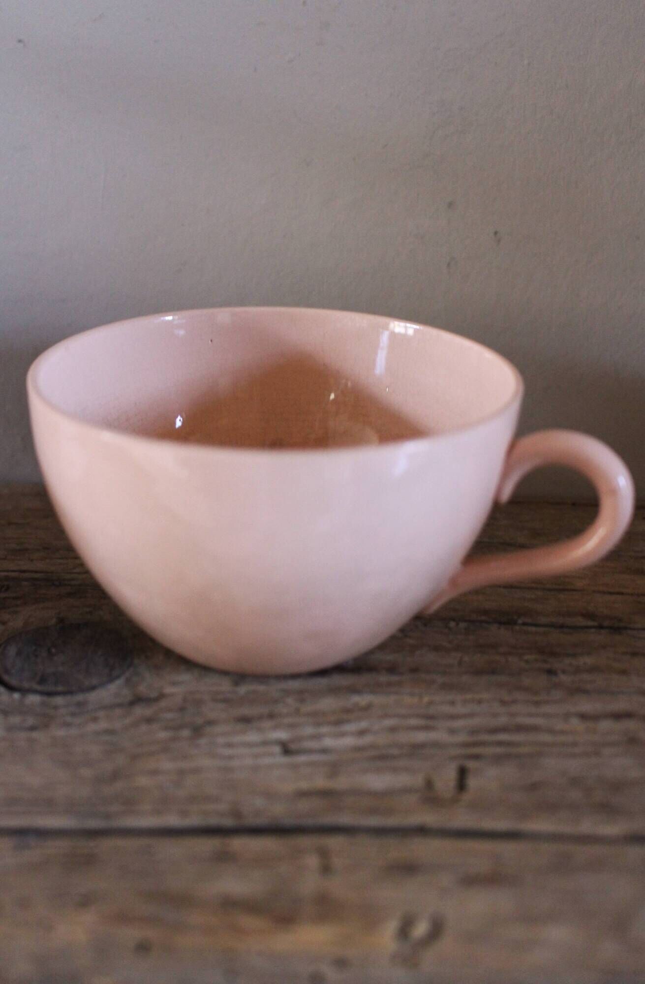 A set of two Digoin Sarreguemines Marylou Rose Art Deco cups.