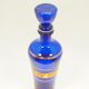 Blue glass decanter with gold decoration